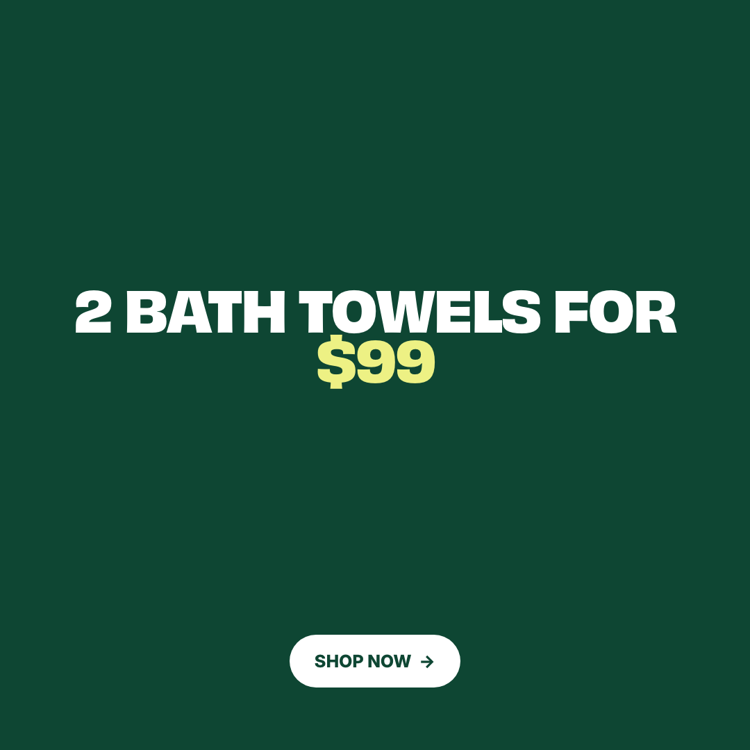 Promotional graphic with the text '2 BATH TOWELS FOR $99' on a dark green background, with a white 'SHOP NOW' button at the bottom.