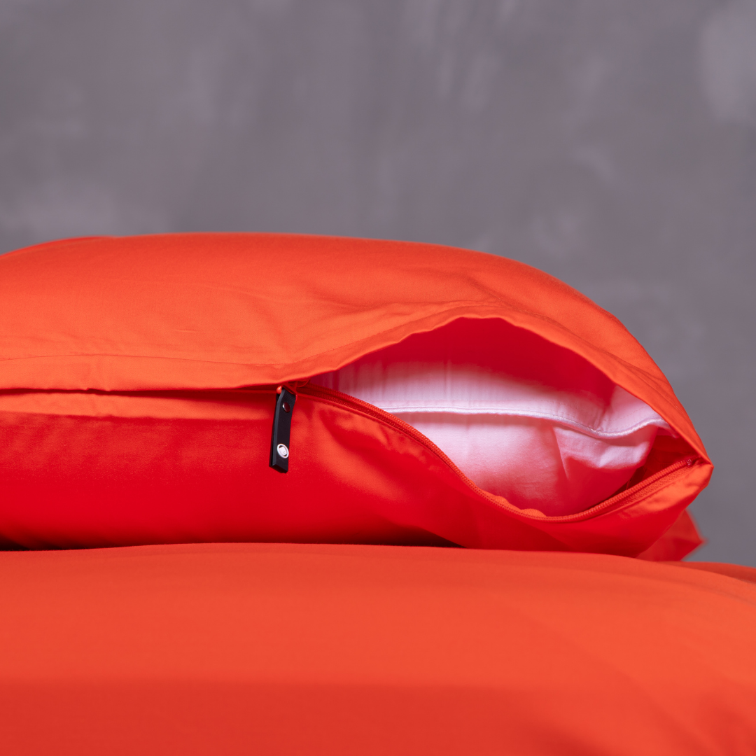 Close-up of red bamboo cotton pillowcase with invisible zip closure design.