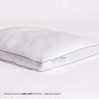 White pillow with a visible brand logo on a white background