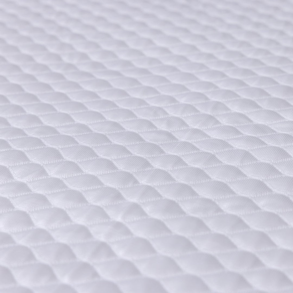 Close-up of white textured fabric on Waterproof Mattress Protector.