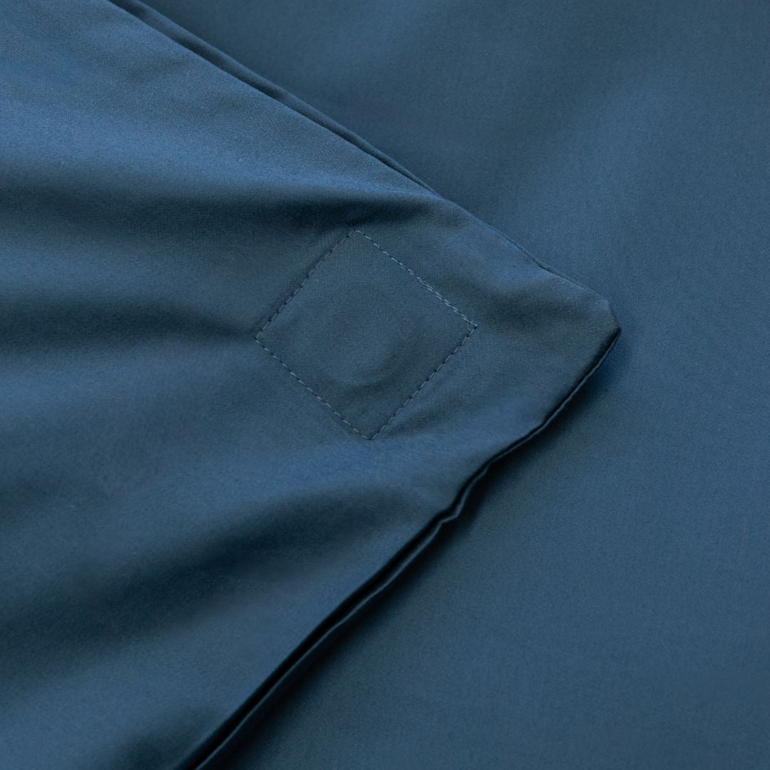Close-up of a blue fabric with a magnetic pocket detail