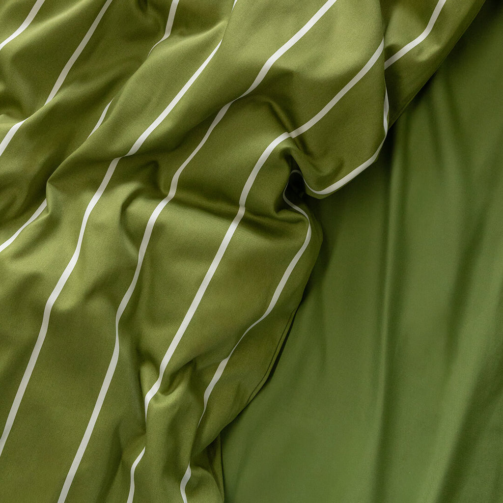 Close-up of green fabric with white stripes.