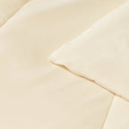 Close up of corner and stitching on the beige / cream coloured cooling blanket.
