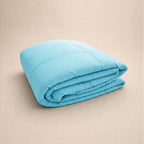 Light bright blue cooling blanket folded.