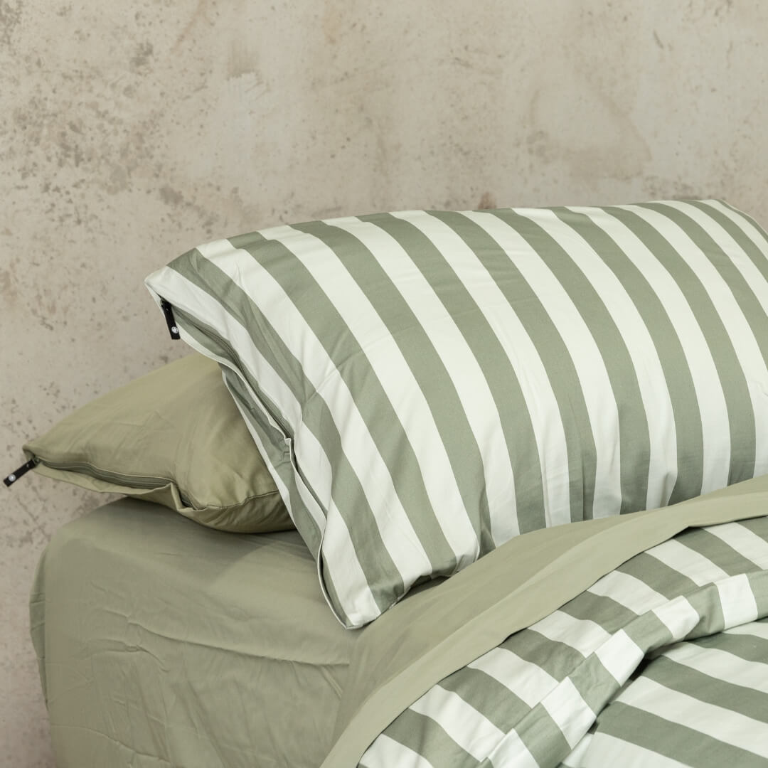Sage green stripe invisible zip pillowcase.