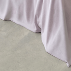 Close-up of the Daylesford quilt cover showcasing the soft fabric drape and neatly finished hem.