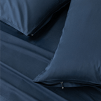 Close-up detail of navy blue pillowcases featuring hidden zipper closures