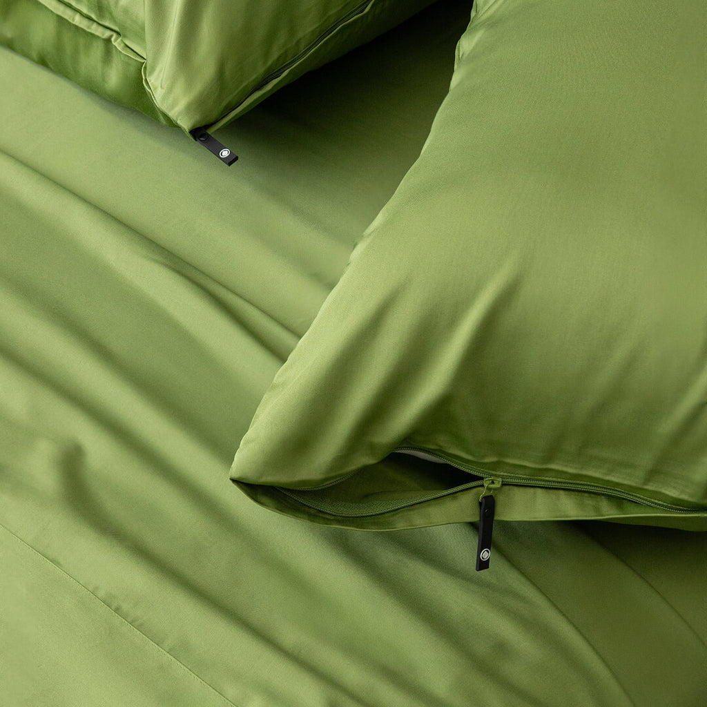 Green sheets with two green pillowcases.
