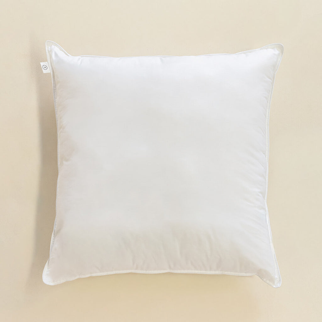 White European pillow on a beige background.