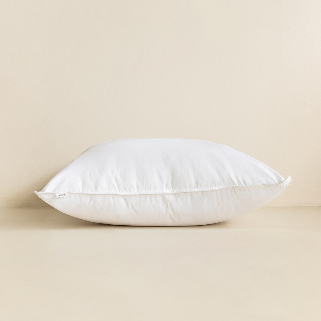White pillow on a beige background.