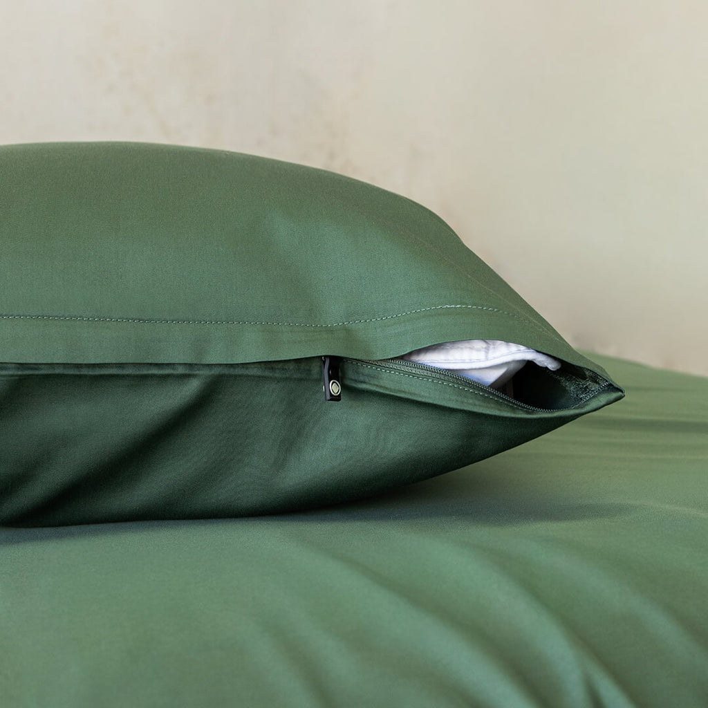 Green pillowcase with zip.