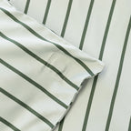 Close up of magnetic corner in stripe quilt cover.