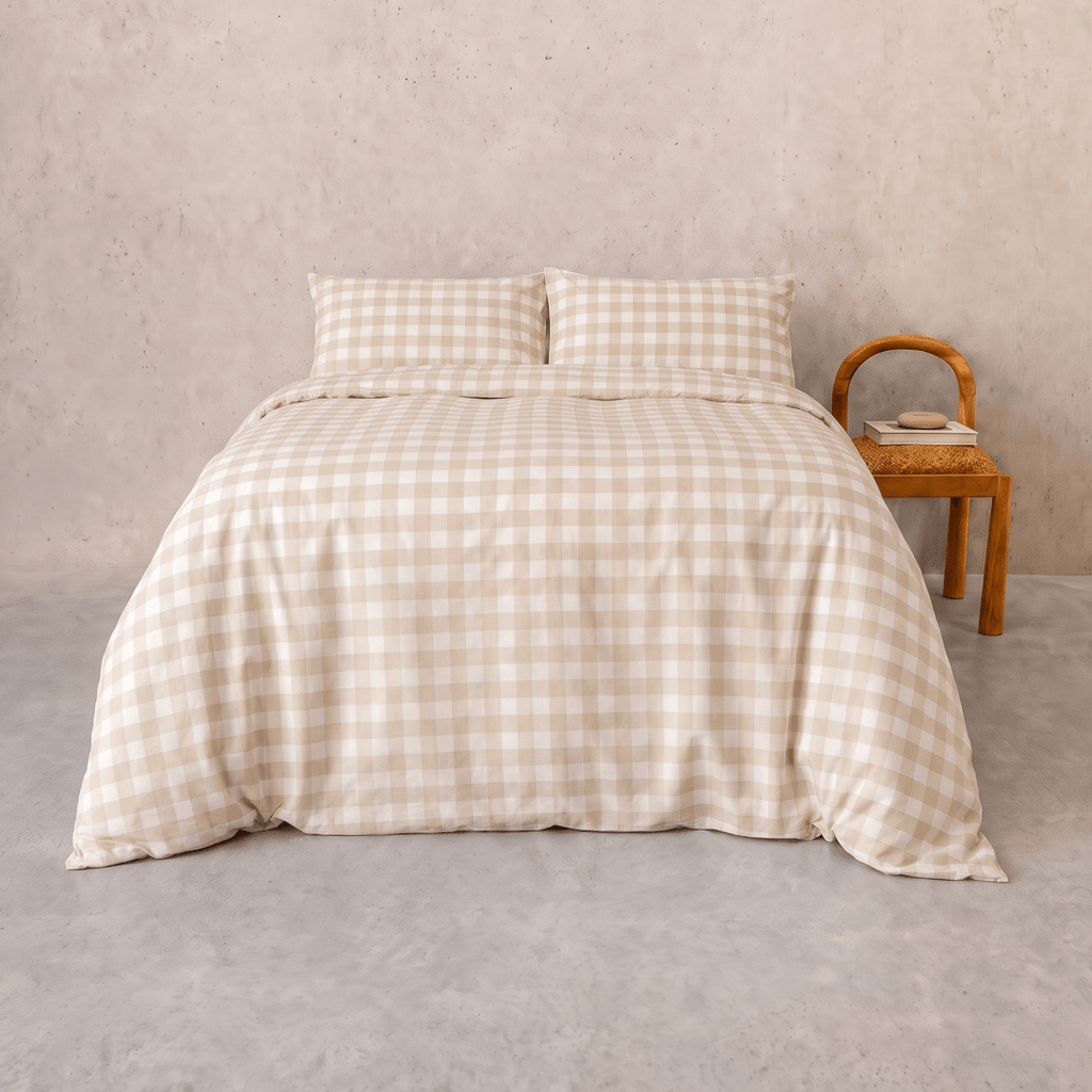 Beige gingham quilt cover set styled on a bed with matching pillowcases, featuring a timeless checkered pattern, soft drape, and warm neutral tones for a cozy bedroom aesthetic.