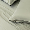 Light grey pillowcases with zips.