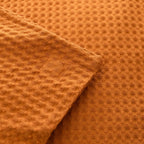 Close-up of orange textured fabric