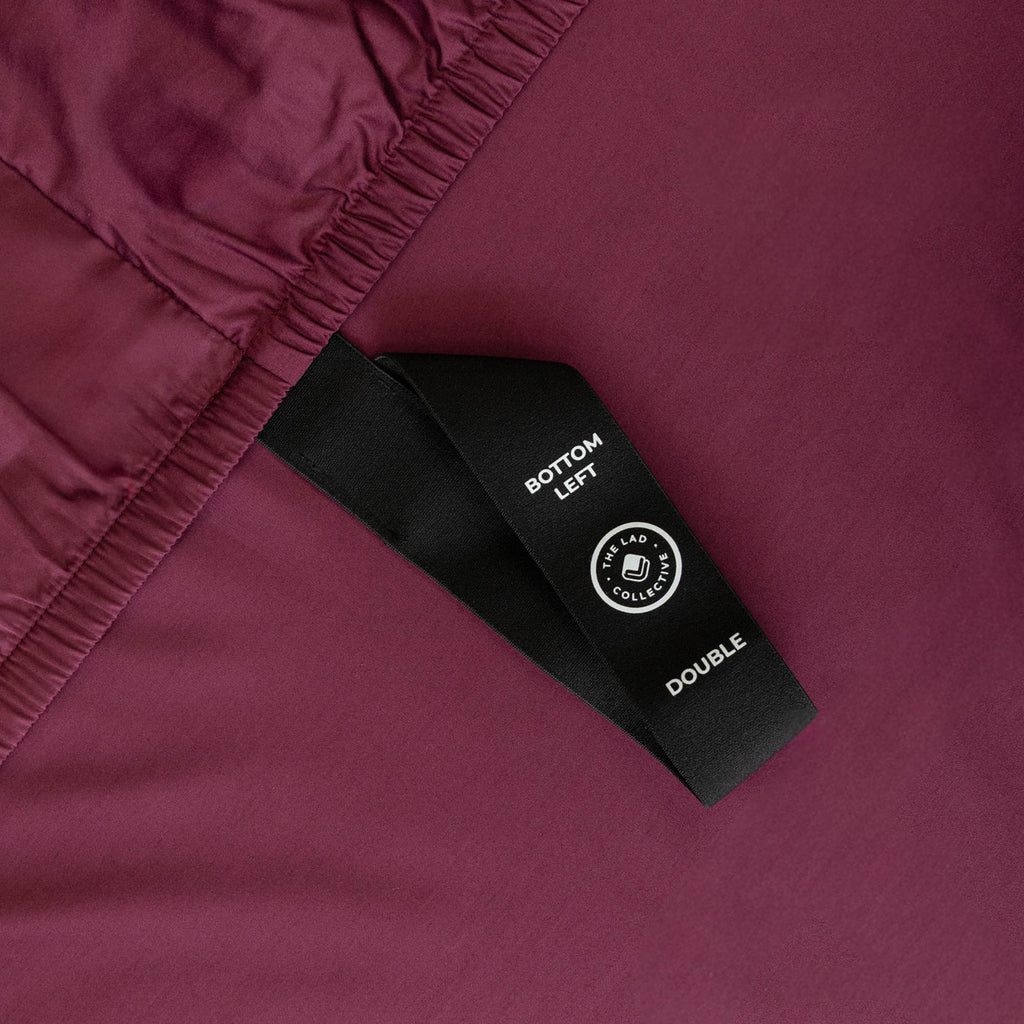 Close up of corner strap in Maroon Bedding.