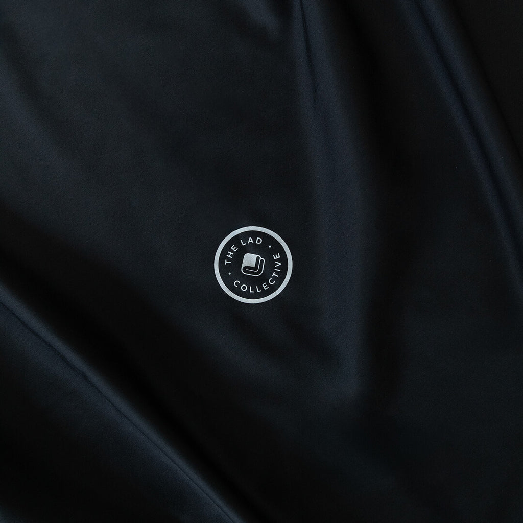 Black fabric with a white logo in the center.