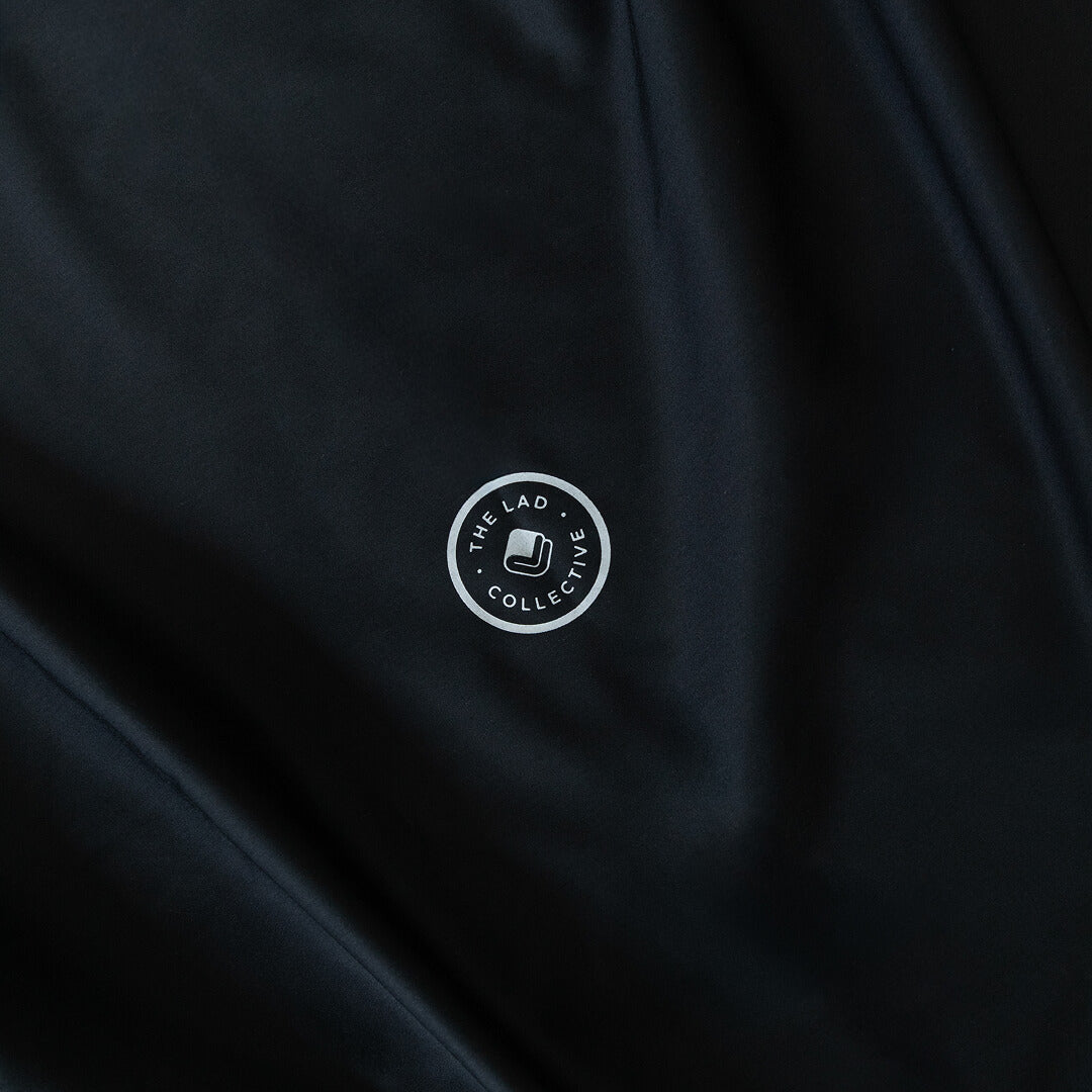 Black fabric with a white logo in the center.