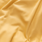Extreme close-up showing the soft drape and silky sheen of golden yellow fabric