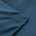 Close-up of a blue fabric with a magnetic clip detail.