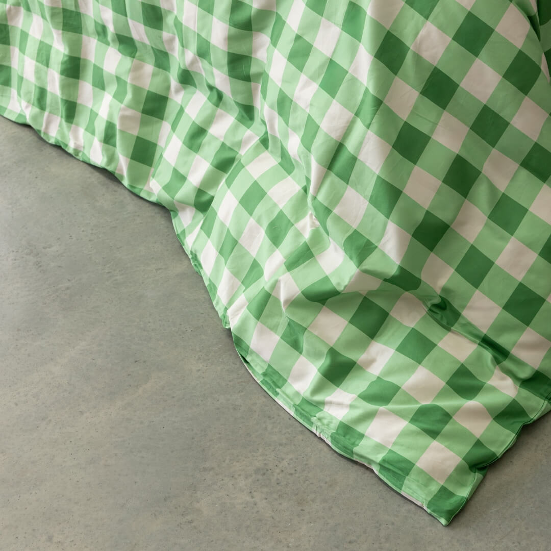 Meadow green gingham print quilt cover close up.
