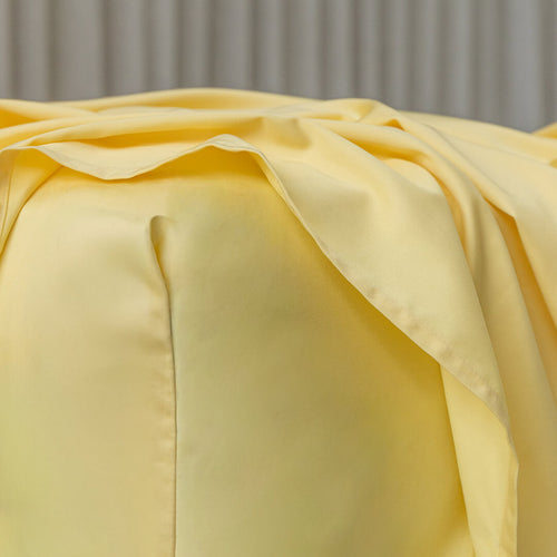 Close-up of a yellow fabric with a soft texture against a neutral background.