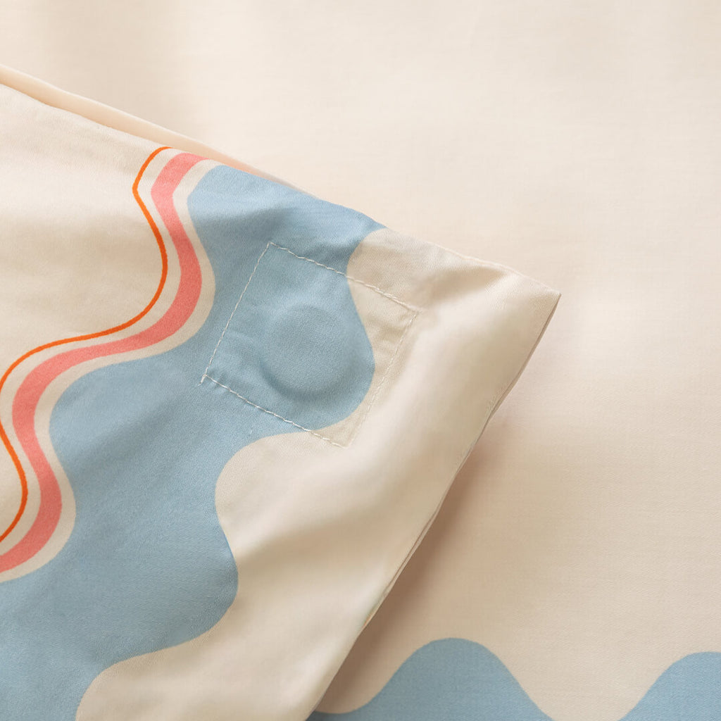 Close-up of magnetic corner duvet cover with wavy pattern.