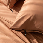 Close-up of a brown pillowcases with a zipper detail.