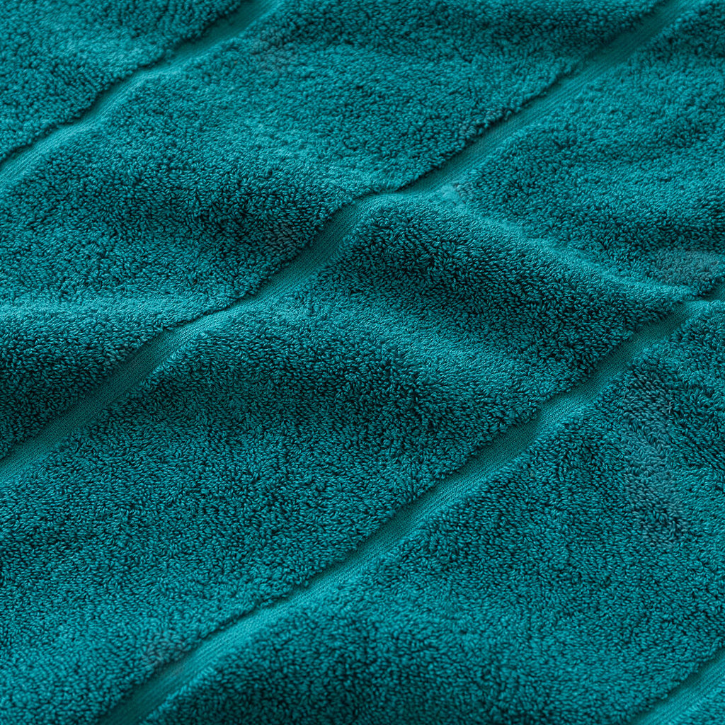 Close-up of teal towel cotton fabric texture.