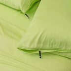 Green pillows on a matching green background.