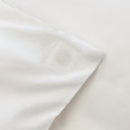 Close-up of white quilt cover corner showcasing magnetic clip.