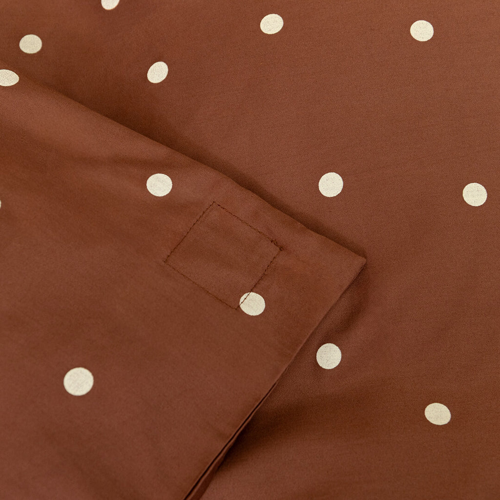 Brown fabric with white polka dots and a magnetic corner clip.
