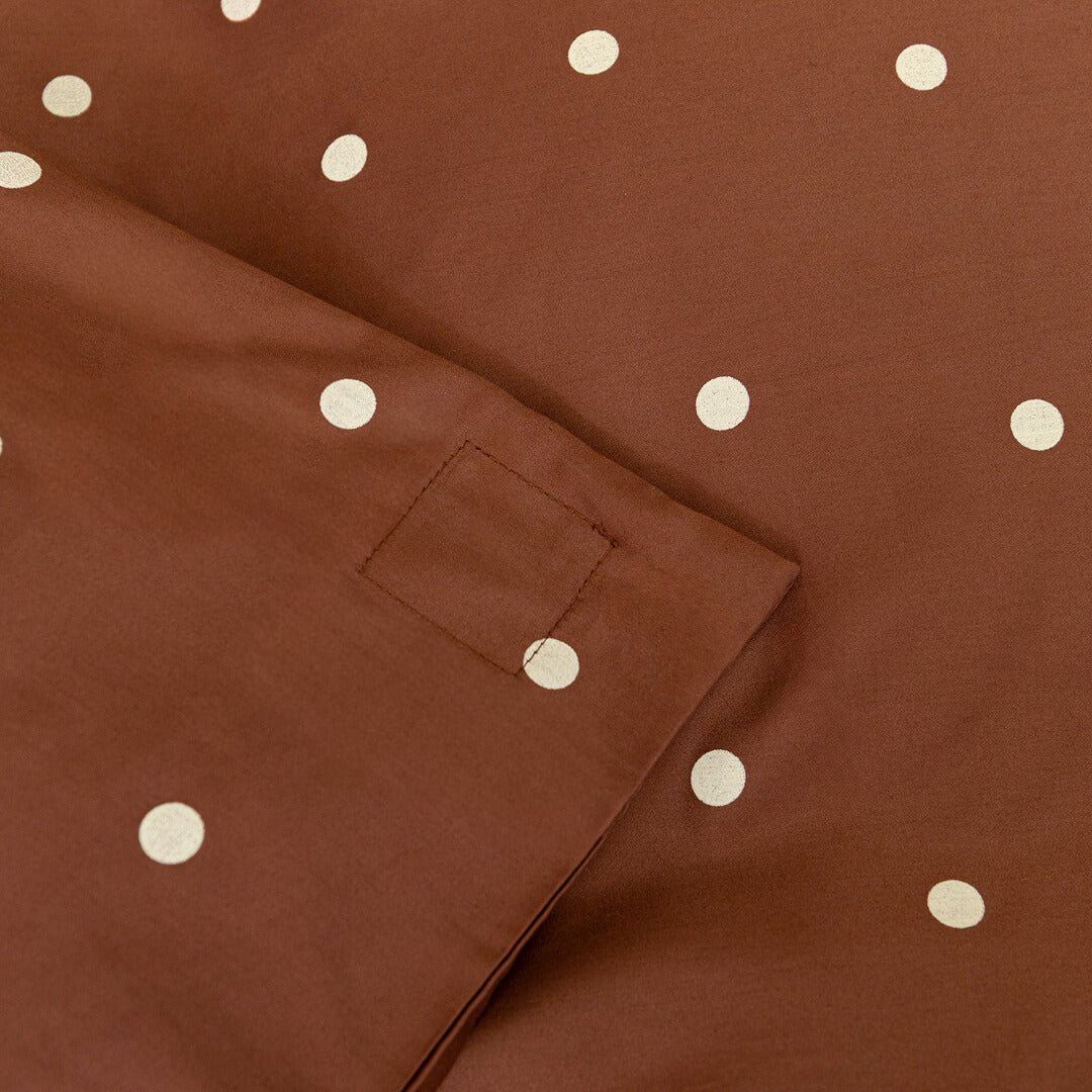 Brown fabric with white polka dots and a magnetic corner clip.