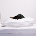Person laying on bed with pillow