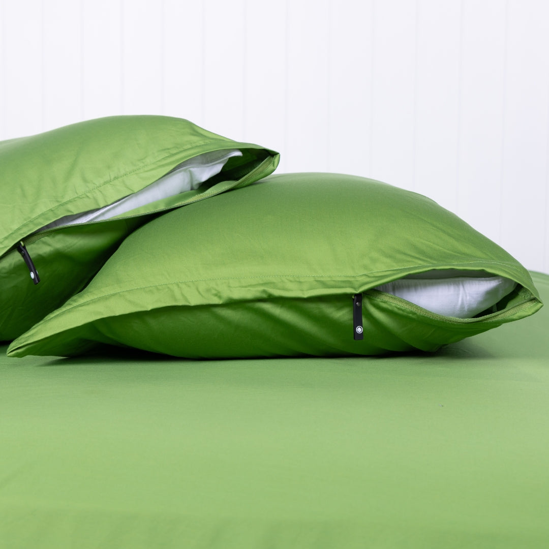 Pair of Palm Cove green pillowcases featuring signature invisible zip detail.