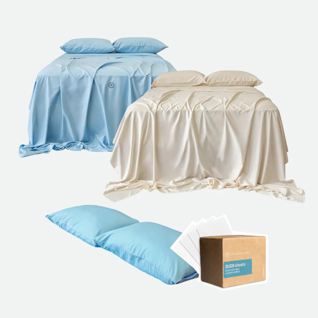 Set of blue and beige bedspreads, pillows, and a box on a white background